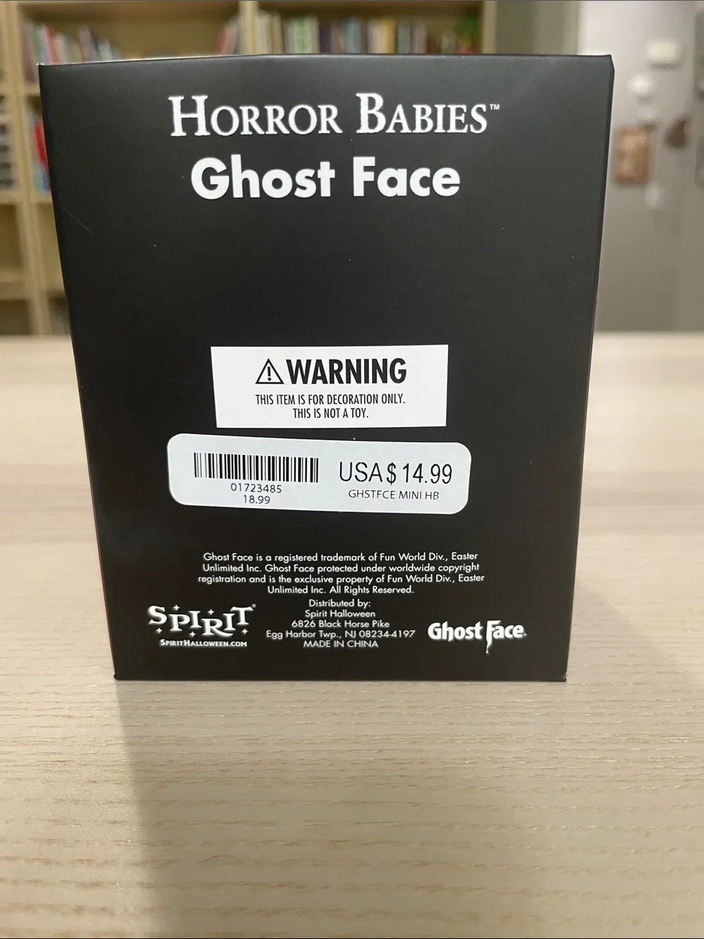 Spirit Ghost Face Figure in Black and White with Red-Accented Knife